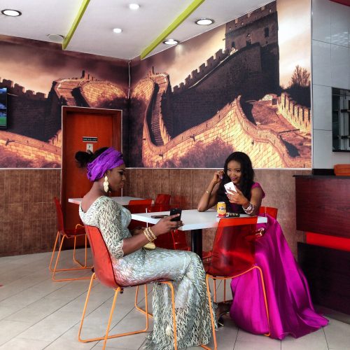 Two women and their cell phones in Lagos, Nigeria.