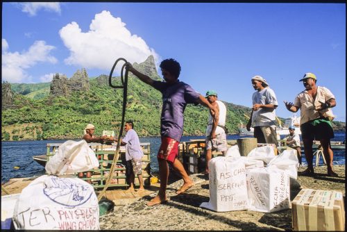 Loading cargo for the Aranui 3 cargo cruise ship at Hatiheu Bay on the island of Nuku Hiva in the Marquesas