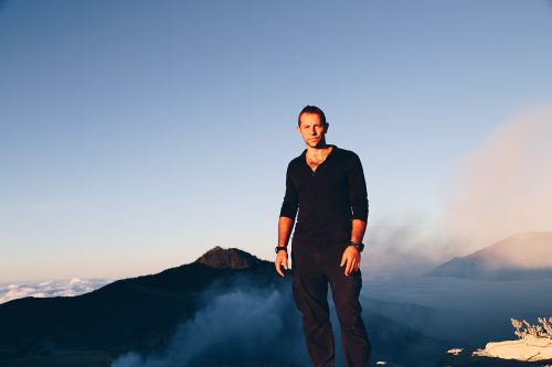 Matt Prior stands on top of a mountain