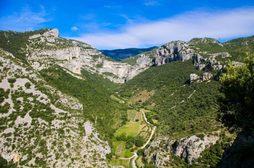 Aerial view of green mountains in the Vallée de l'Hérault: kayaking in France