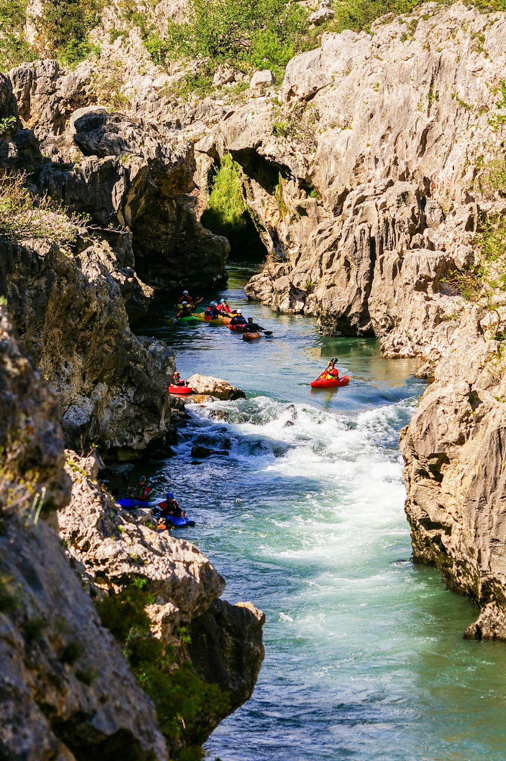 Kayakers go down a chasm in the Vallée de l'Hérault; kayaking in France