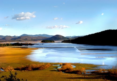 Lake Cerknica in Slovenia, when viewed with water in it, surrounded by autumn colors