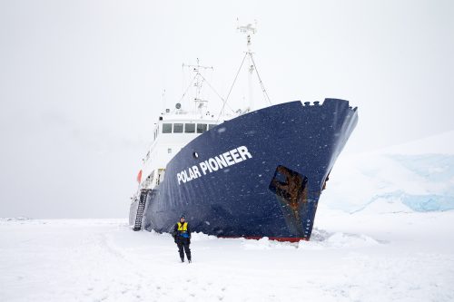 The photographer in front of the Polar Pioneer ship in Antarctica.