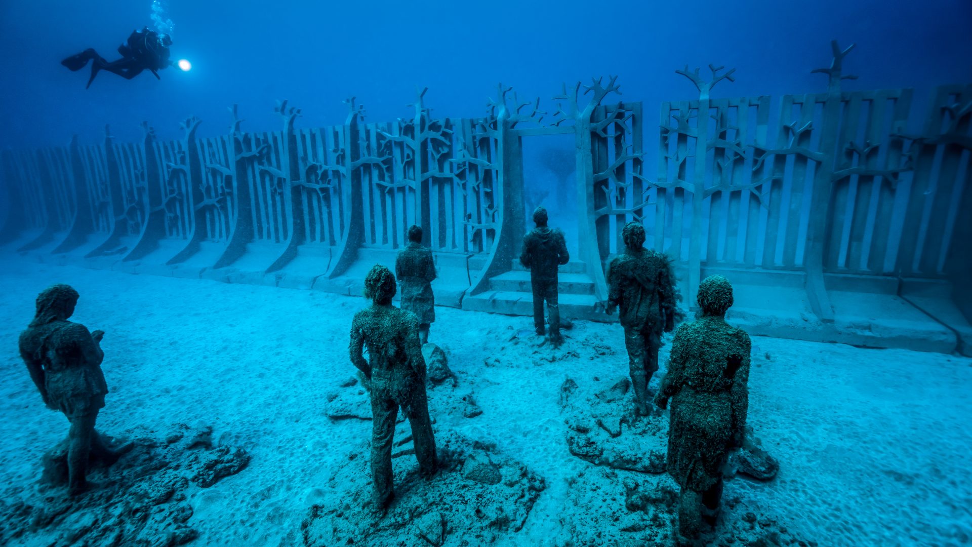 One of the pieces (Crossing the rubicon) in the underwater sculptural piece known as Vicissitudes by British artist Jason deCaires Taylor.