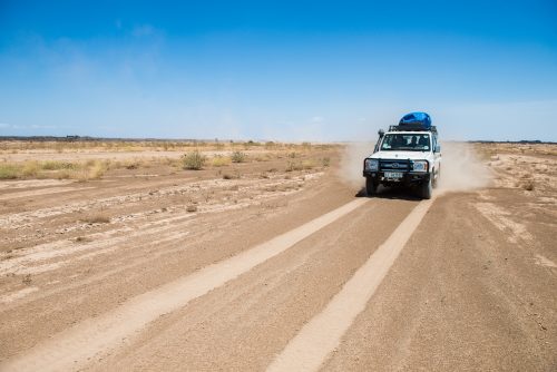 A jeep drives one of the dirt roads in the Danakil Depression