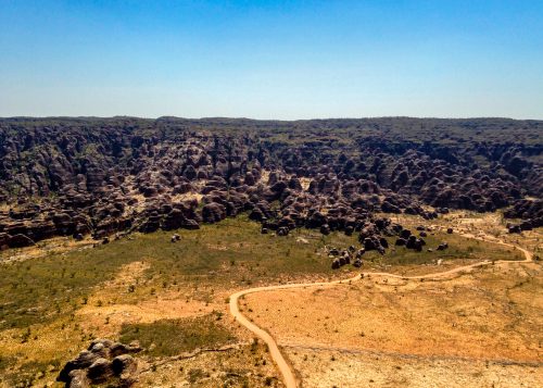 A path can be seen winding through an Australian valley