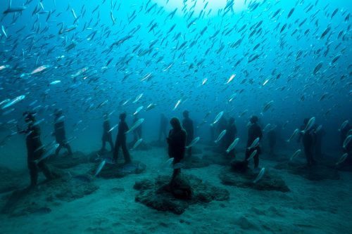 One of the pieces (Crossing the Rubicon) in the underwater sculptural piece known as Vicissitudes by British artist Jason deCaires Taylor.