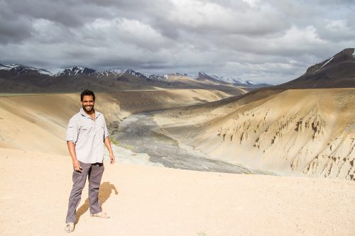 Writer Ashwin Bhardwaj stands above the deep arid valley on the Malai to Leh Highway in the Himalayas
