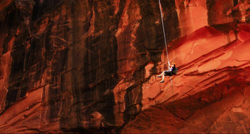 Woman descends into cave in Moab, USA