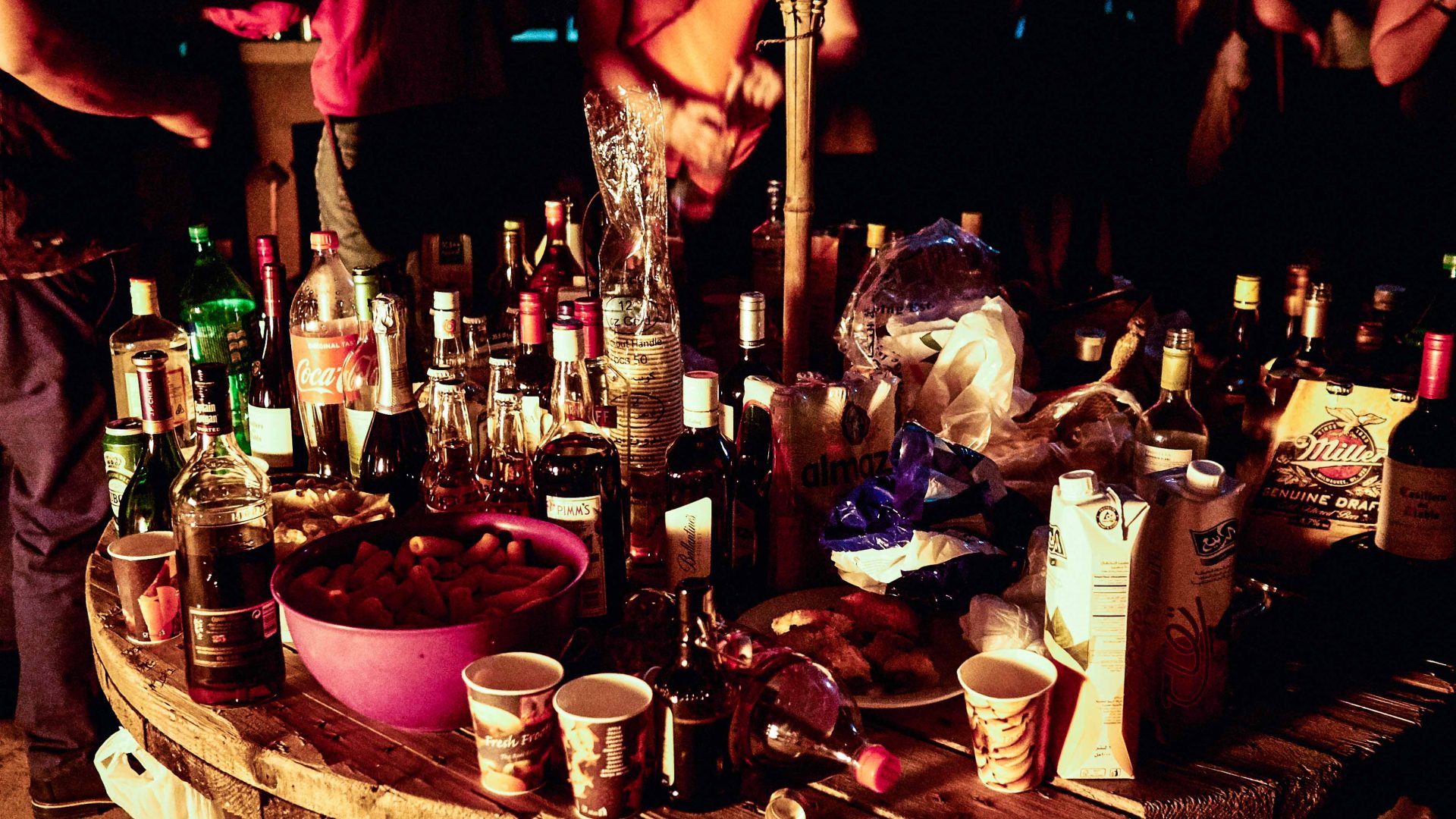 Bottles litter a table at an event in Erbil, Iraq.