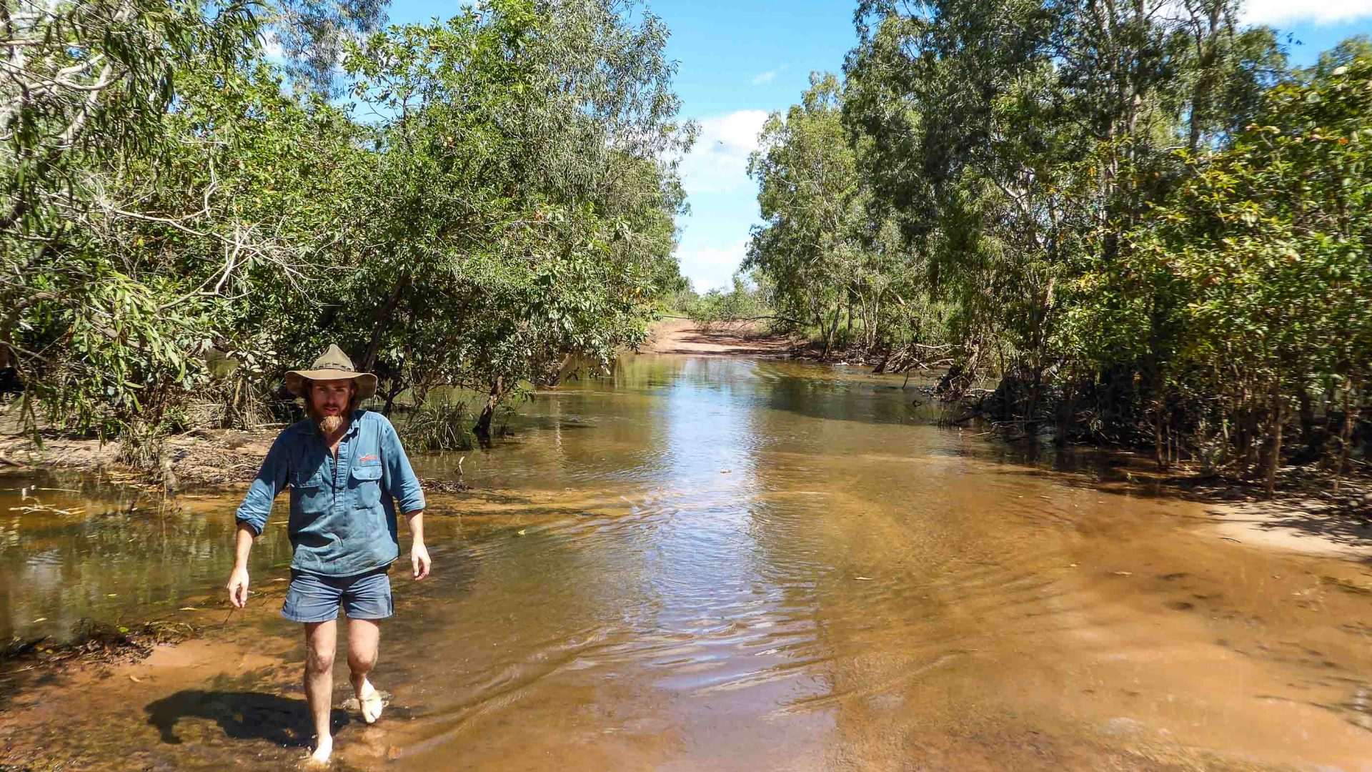 Walking through the river on the road to the Cobourg Peninsula, Australia.