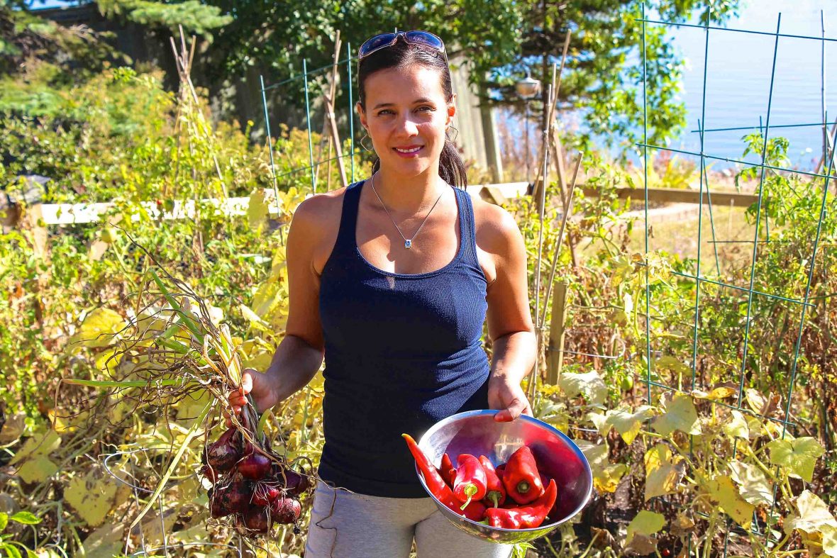 Canada First Nations cuisine: Feast Café Bistro owner Christa collects ingredients from the garden for the restaurant.
