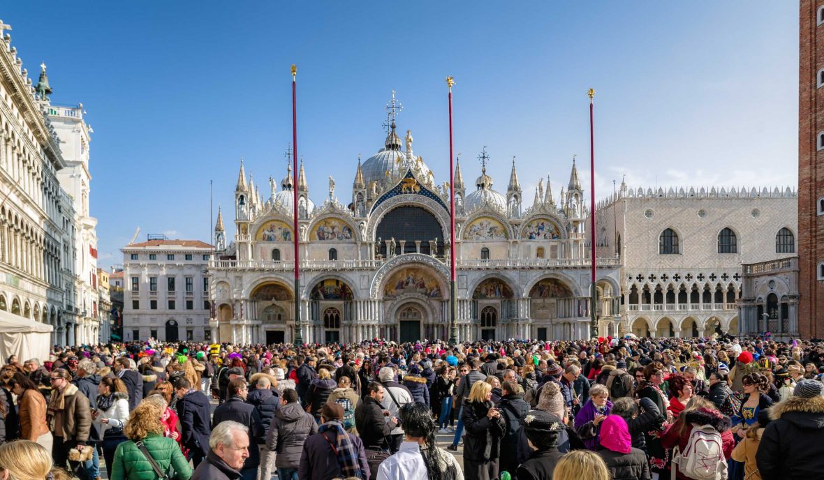 Tourists swarm St Mark's Square / Piazza San Marco in Venice.