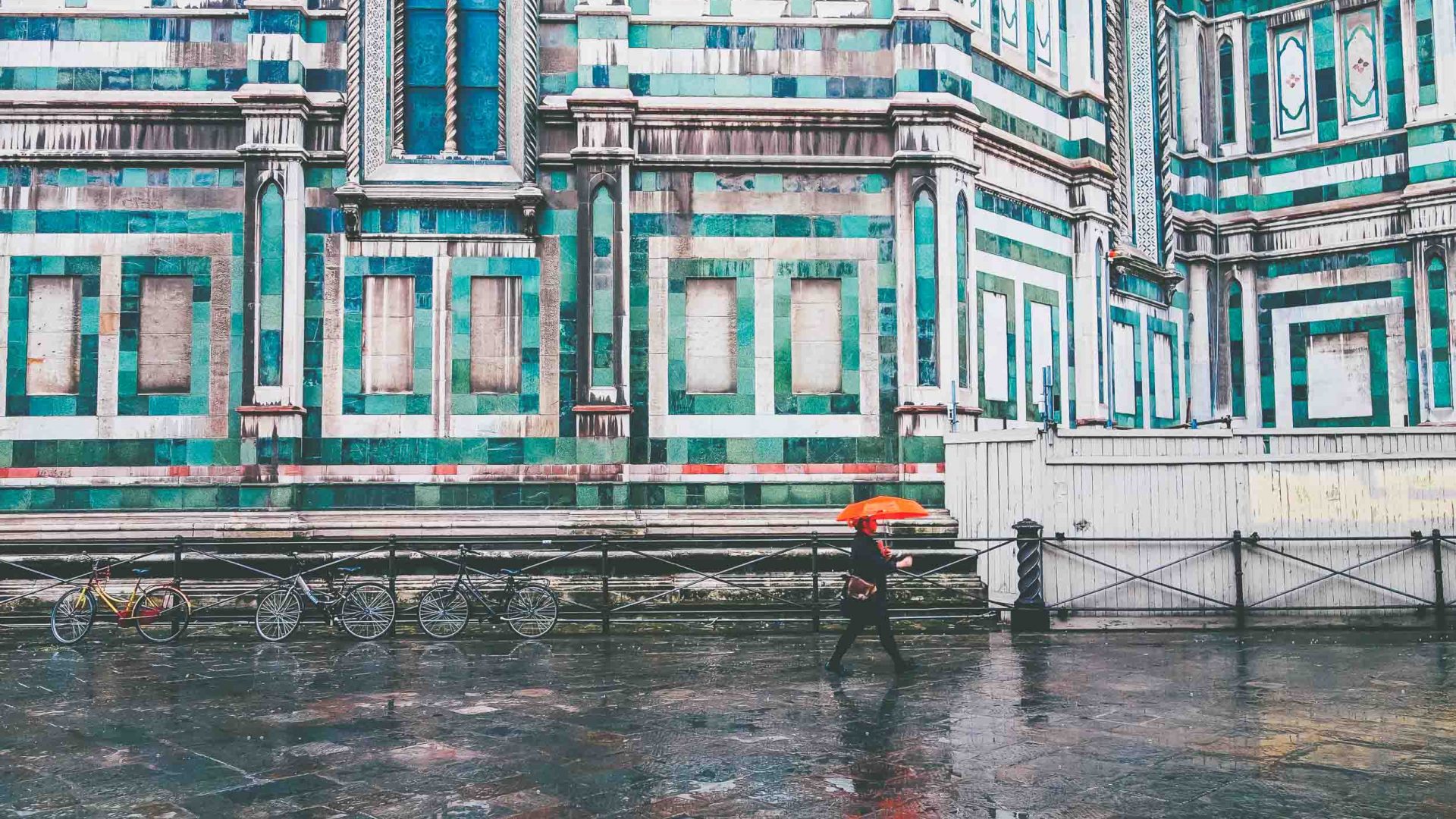 A person walks past the architecture in Florence, Italy.