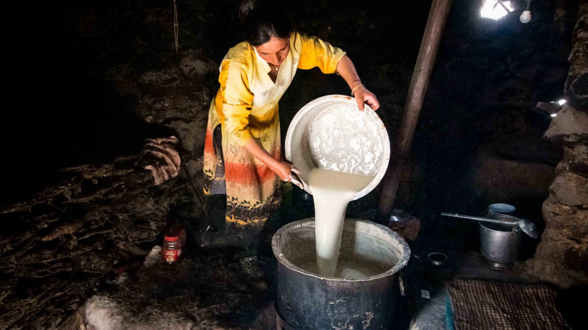 Inayat Bakht begins the long, laborious process to boil and reduce milk for butter and cheese.