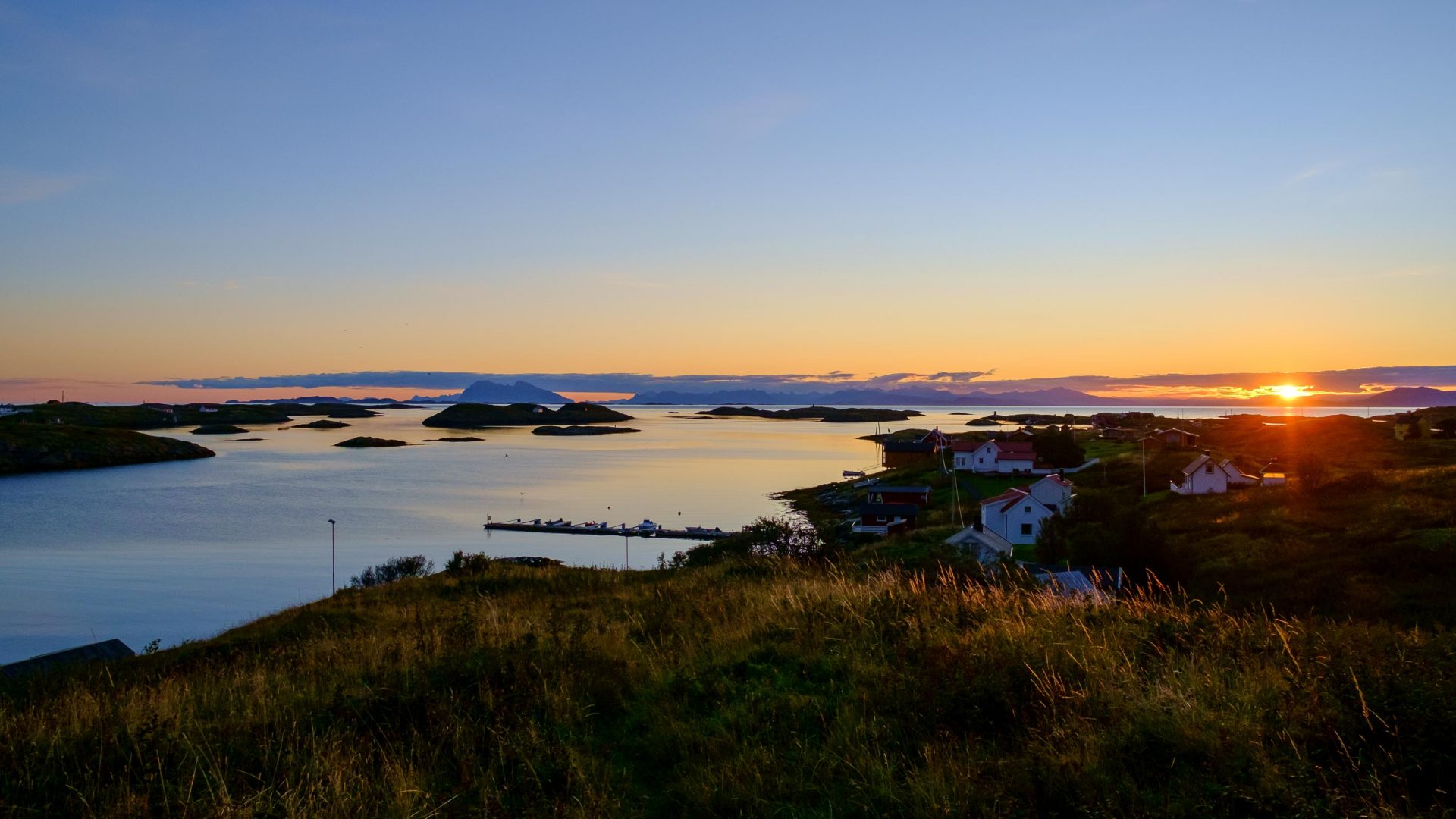 A golden sunrise over the Fleinvaer archipelago, Norway.