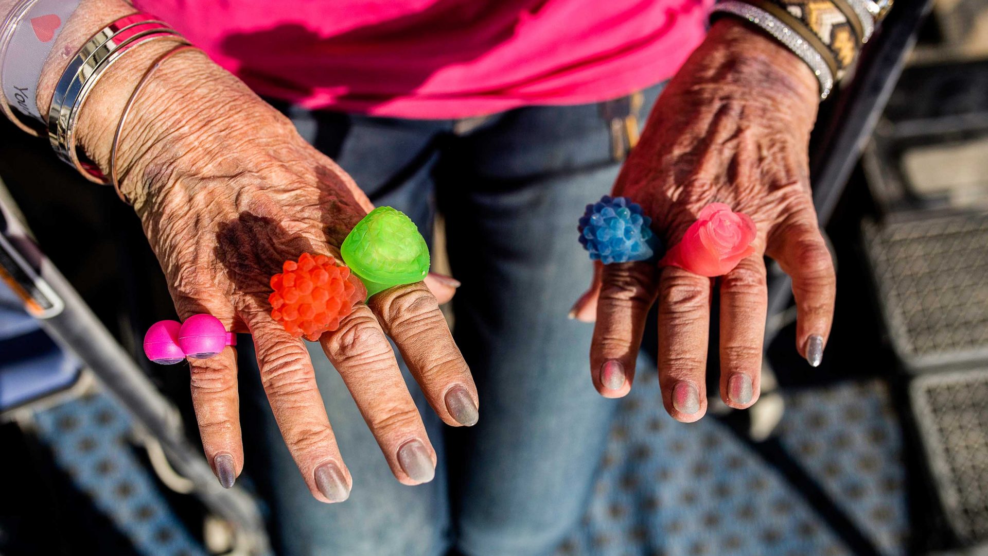 Carolyn Monroe, 81, shows off the rings she got at Burning Man. She plans to wear them to her next chemo treatment.