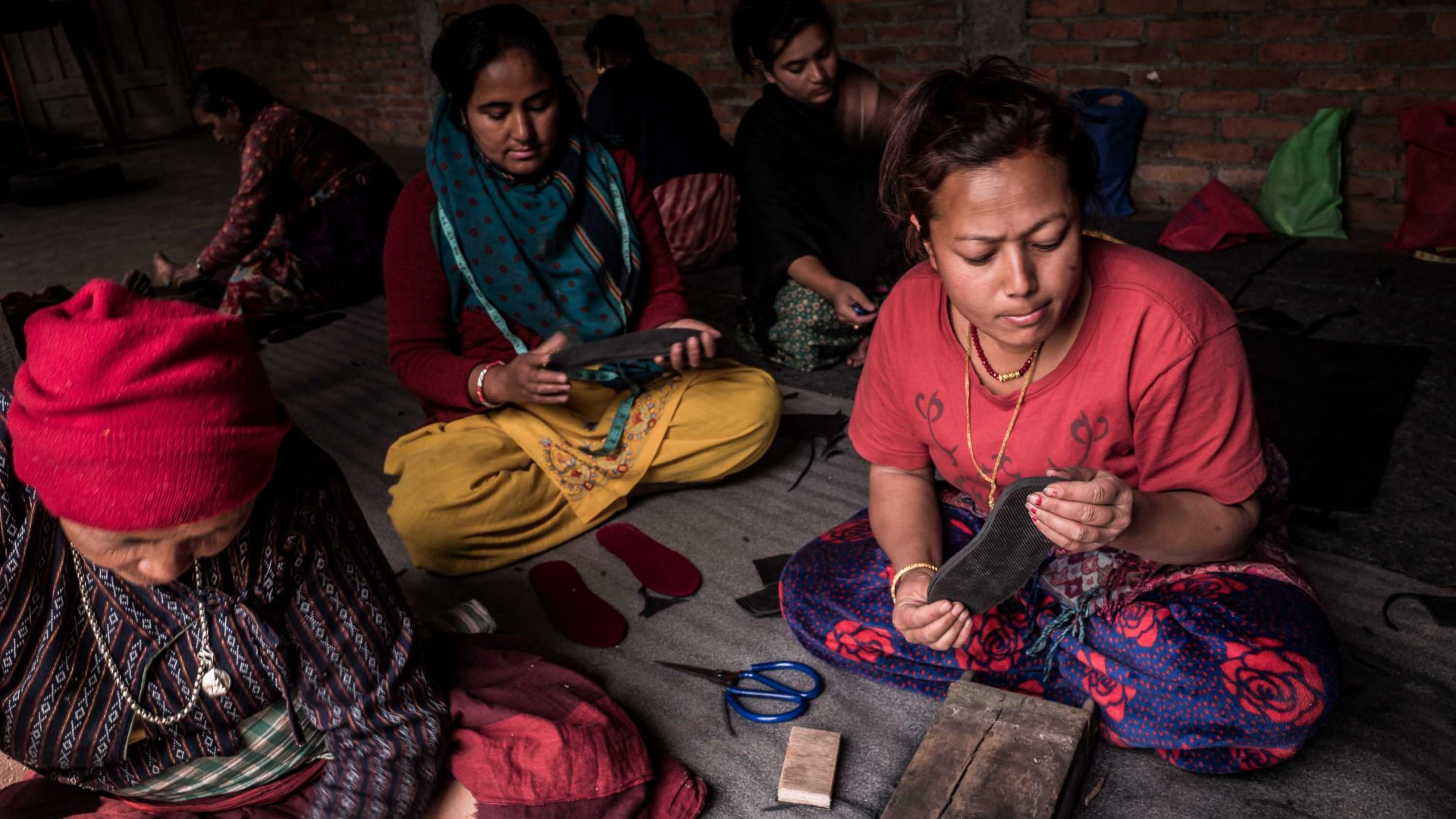 Tami Maja Maharjan and other women take part in shoe-making training designed by to help local widows acquire independence, in the Newari village of Sunakoti, Kathmandu valley.
