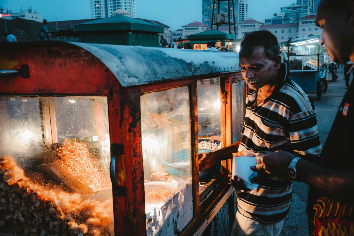 A vendor at his food stall in Colombo, Sri Lanka.