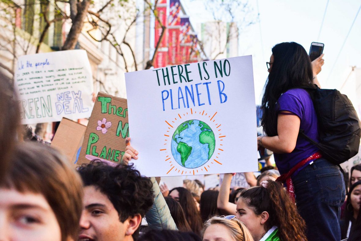 Climate protesters in San Francisco hold a placard saying 'There is no planet B'.