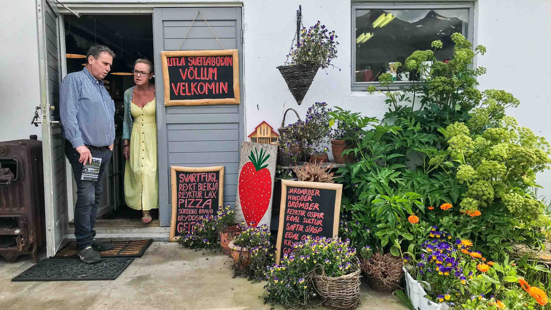 Bjarni Oskarsson and his wife outside their organic farm shop in Vellir.