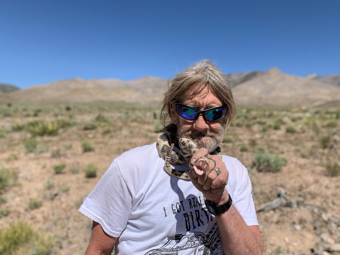 Gordy from Vegas Off Road Tours poses with a fake rattlesnake.