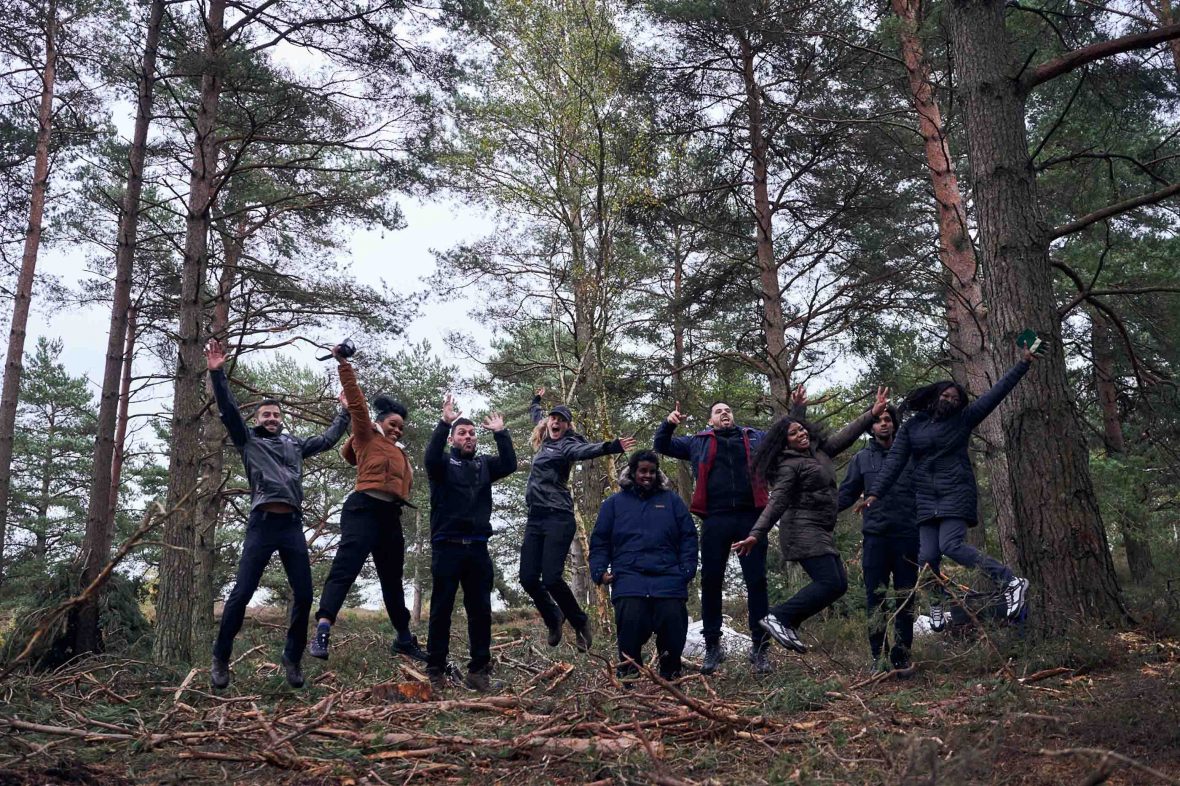 Street Elite participants do a group jump in South Downs National Park in England.