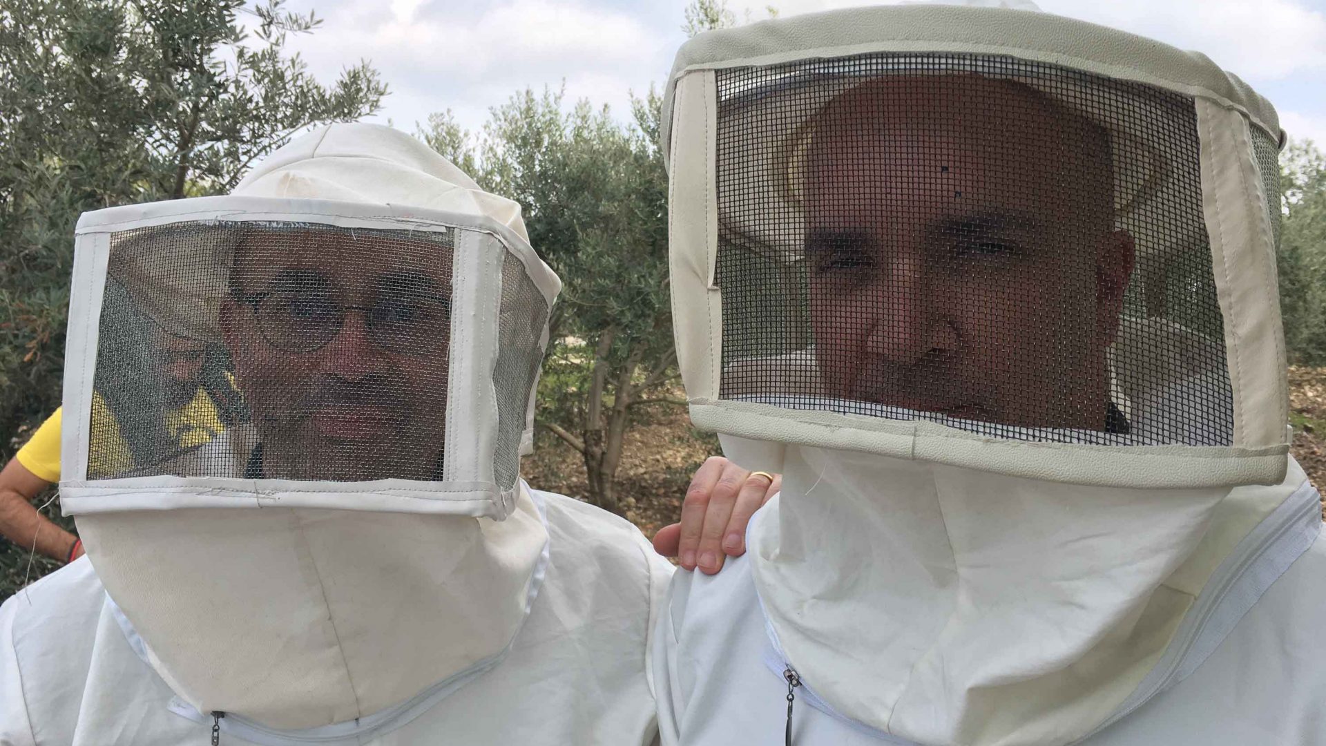 Matthew Teller and Ryan Knighton hear 5,000 bees while beekeeping in Umm Qais.