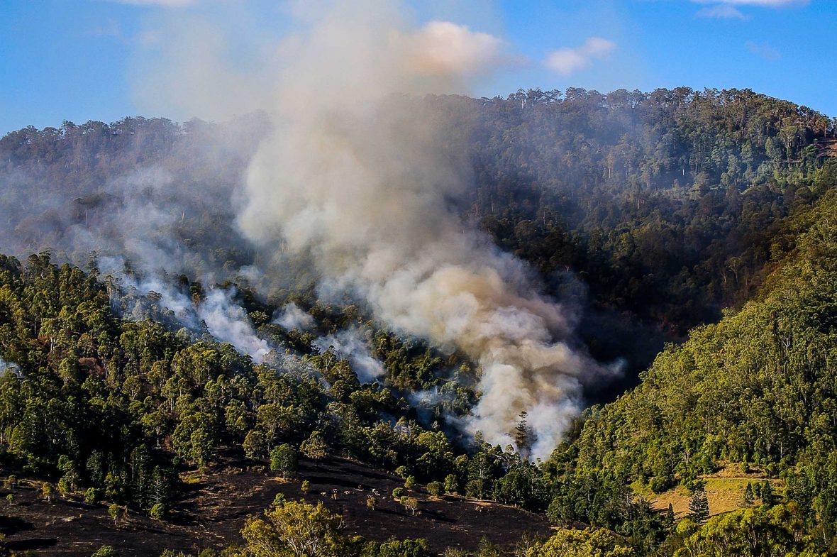 A bushfire burns through the Australian landscape.