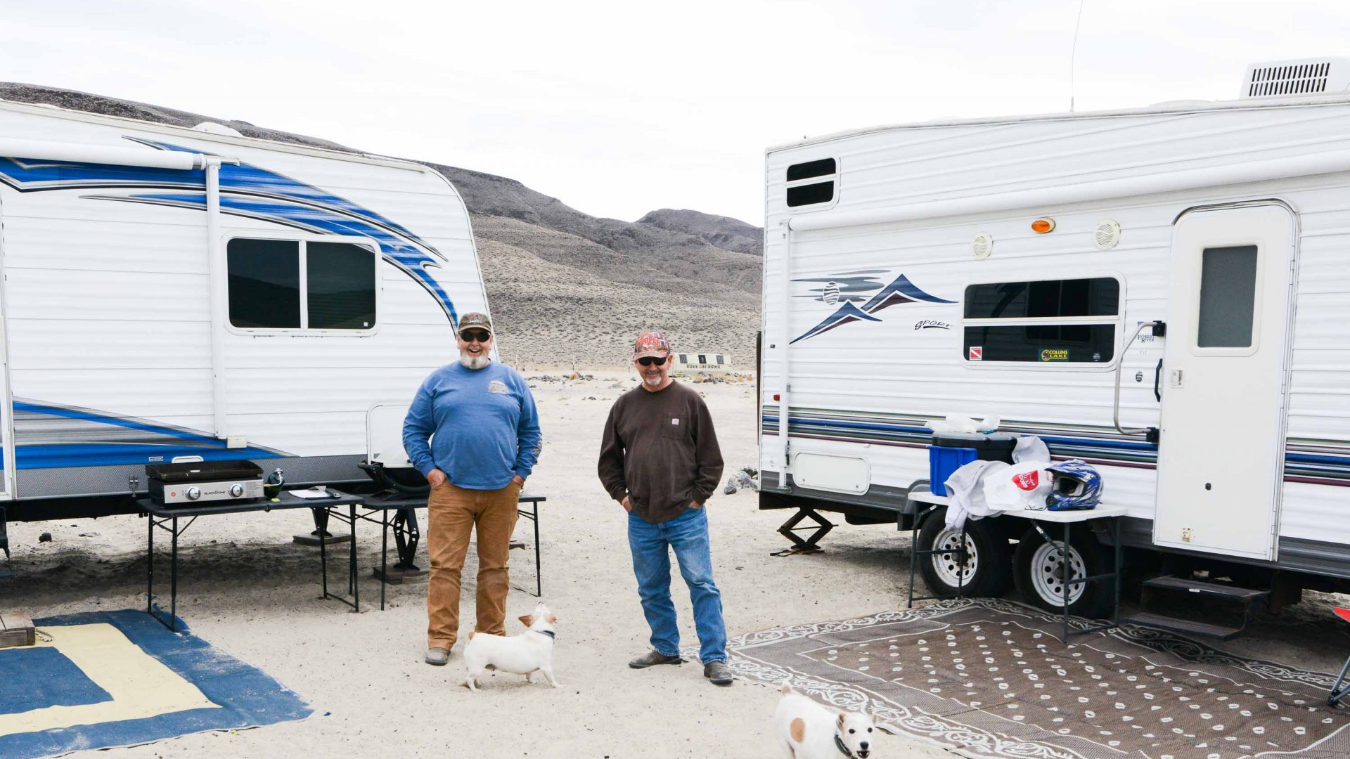 Two men stand out front of their RV's at Sand Mountain.