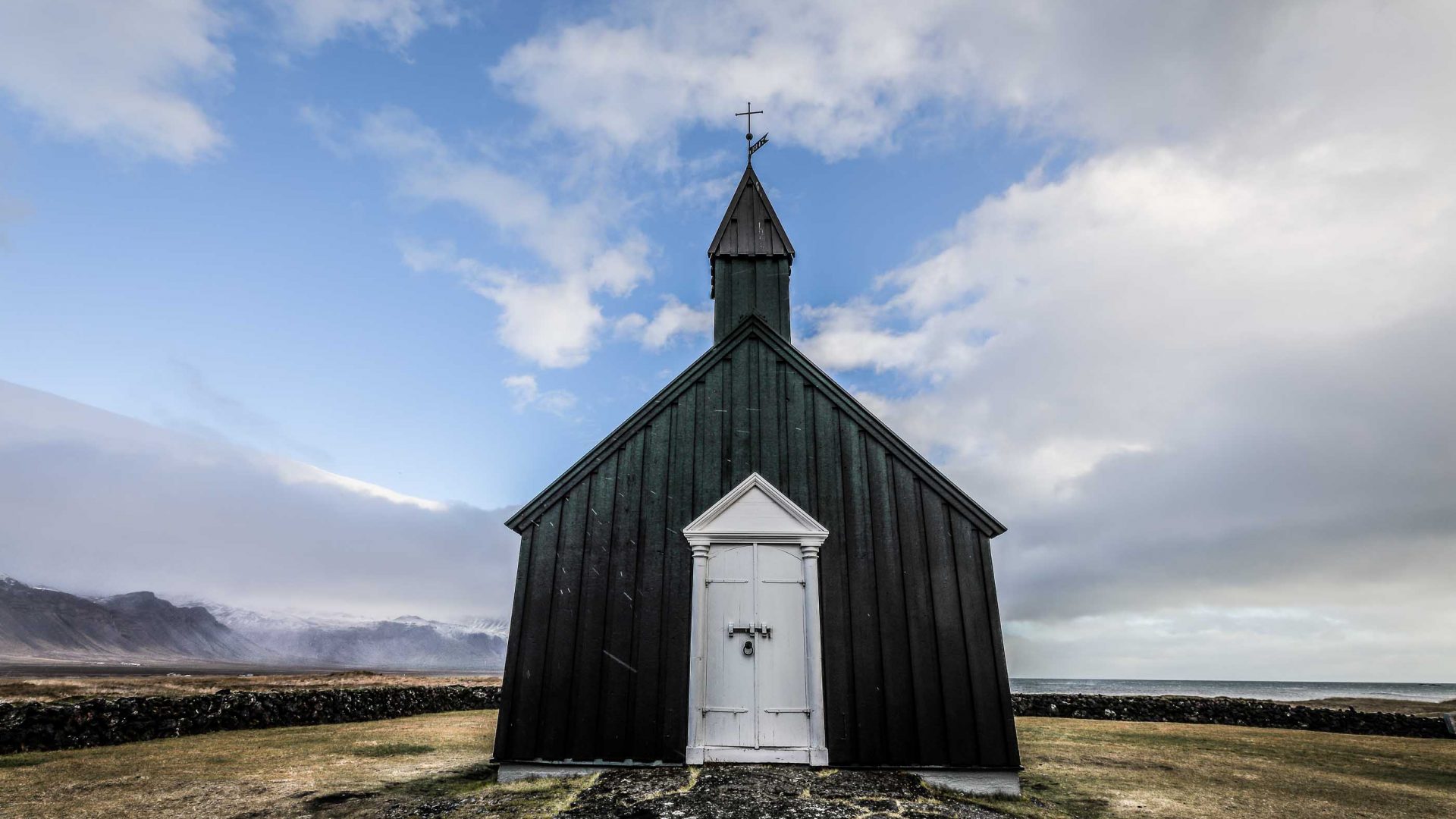 A church stands alone in the barren landscape of the Arctic North.