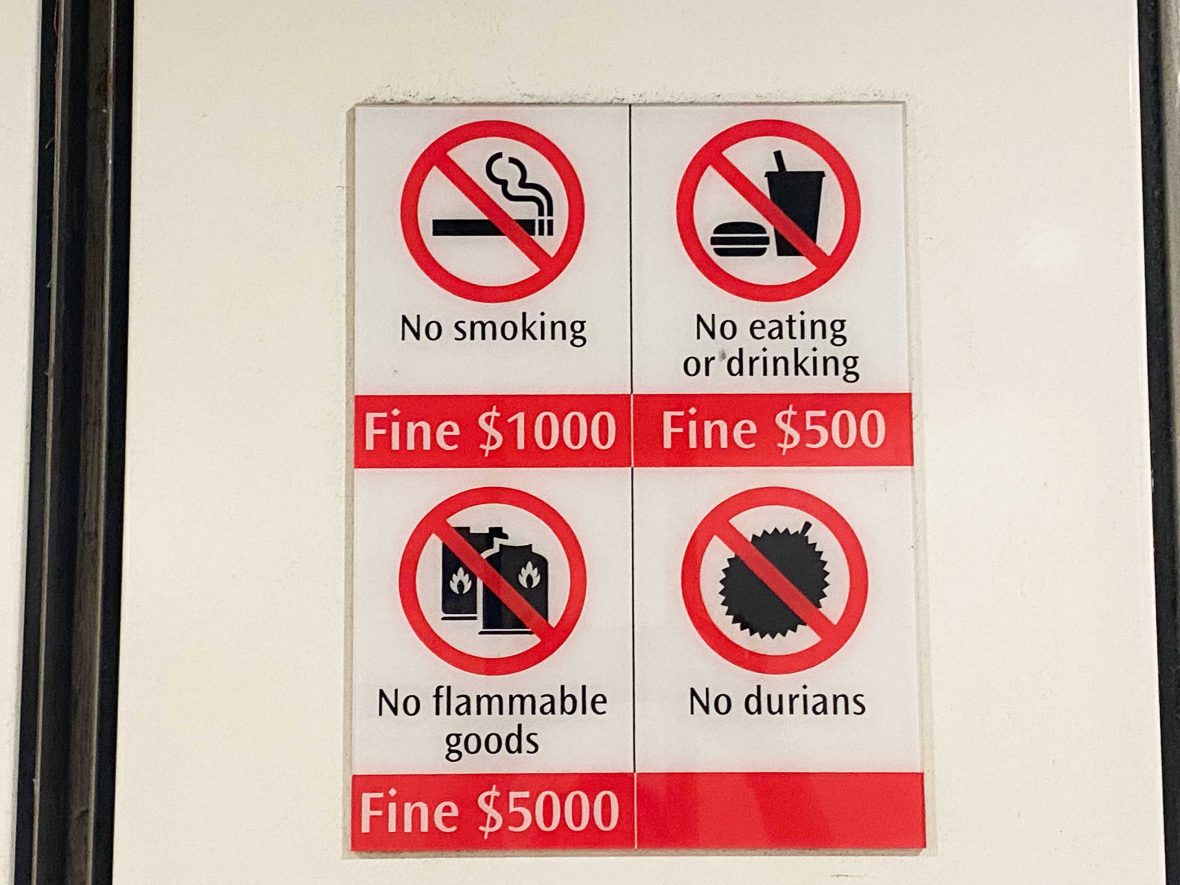 A sign prohibiting smoking, drinking, flammables and durian.