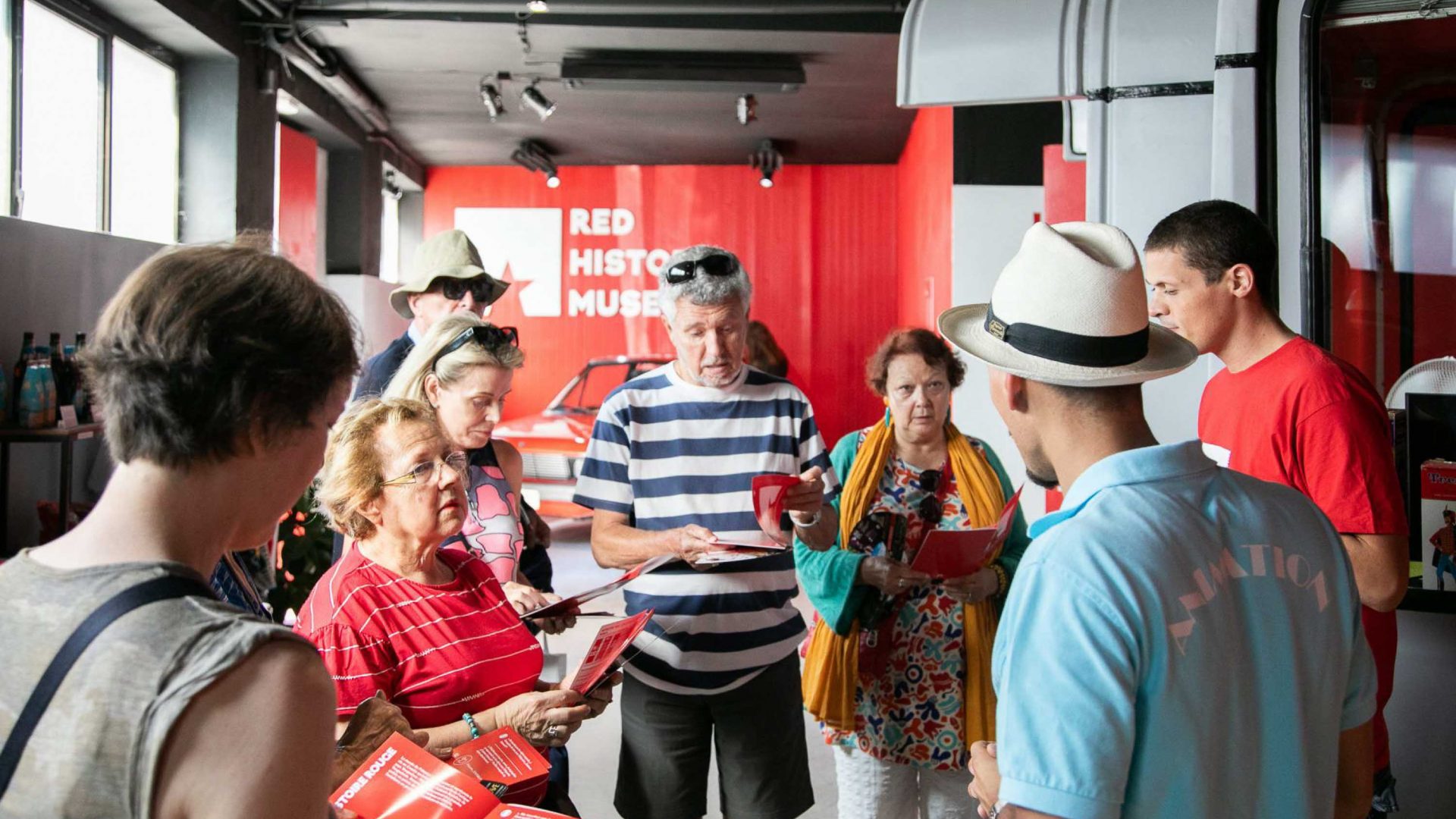 A group of visitors inside the Red History Museum.