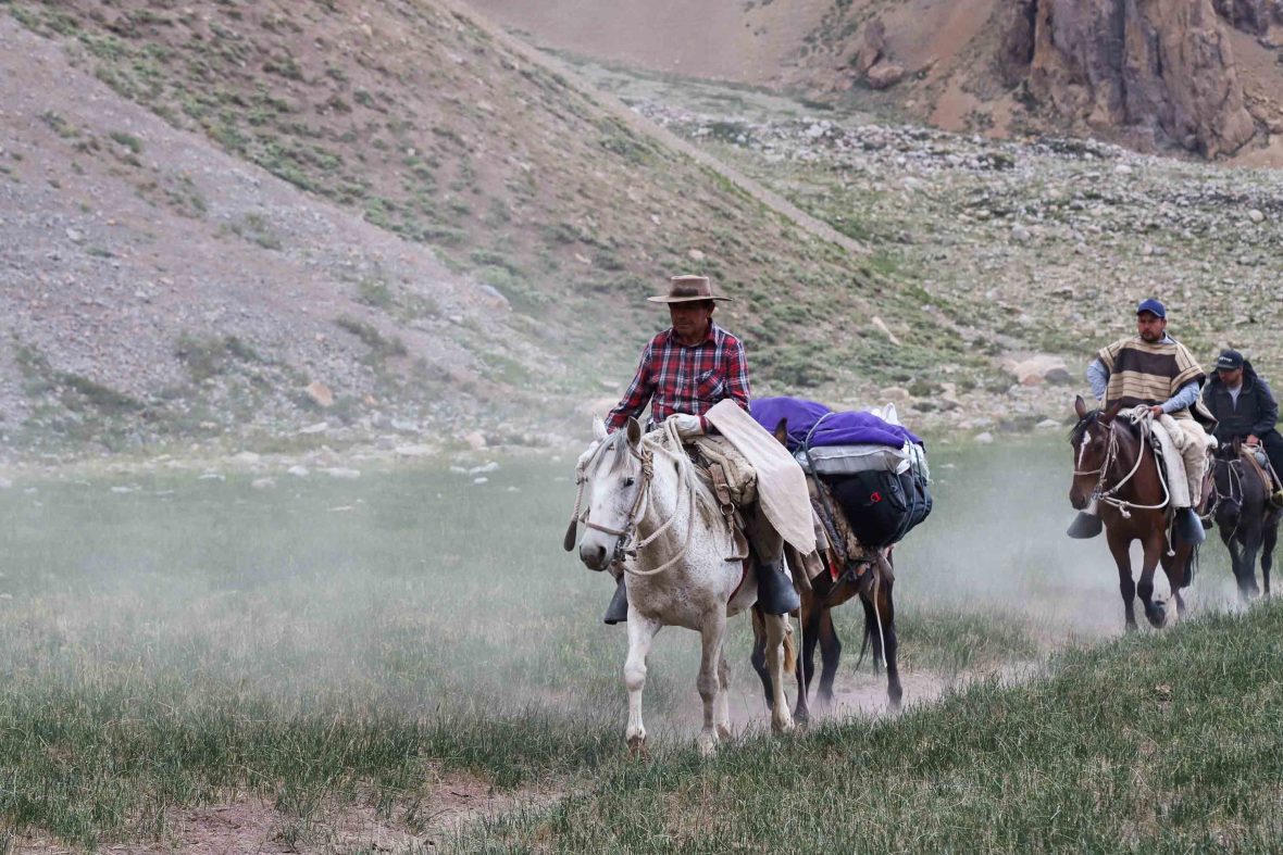 A man rides a horse in the National Park.