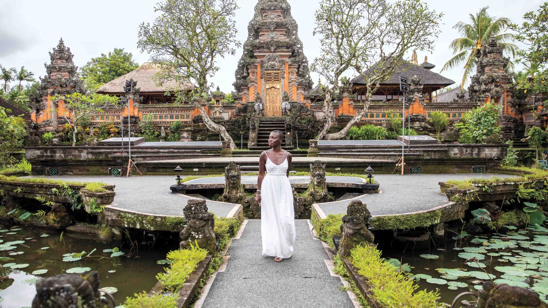 A woman, Jessica, pictured in front of a temple in Bali.