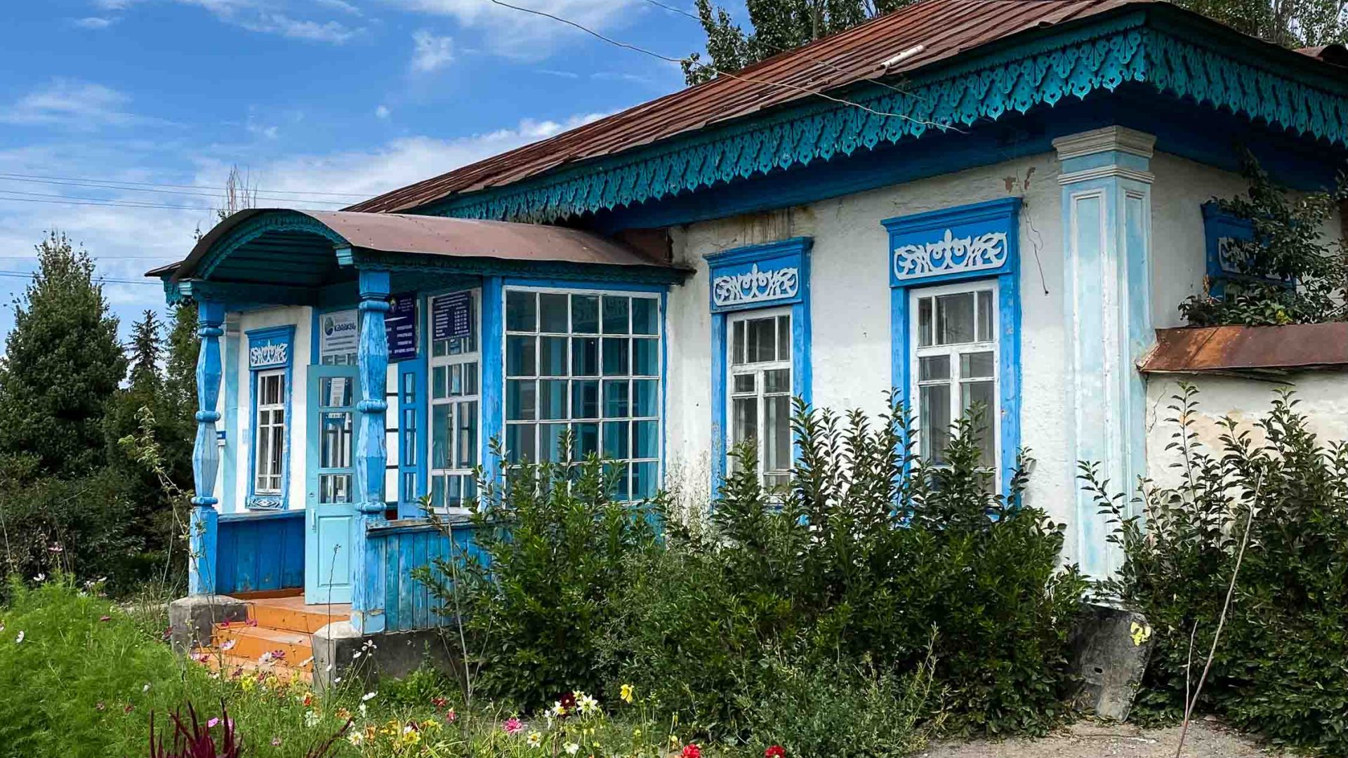 A home in the Russian quarter which has painted blue shutters.