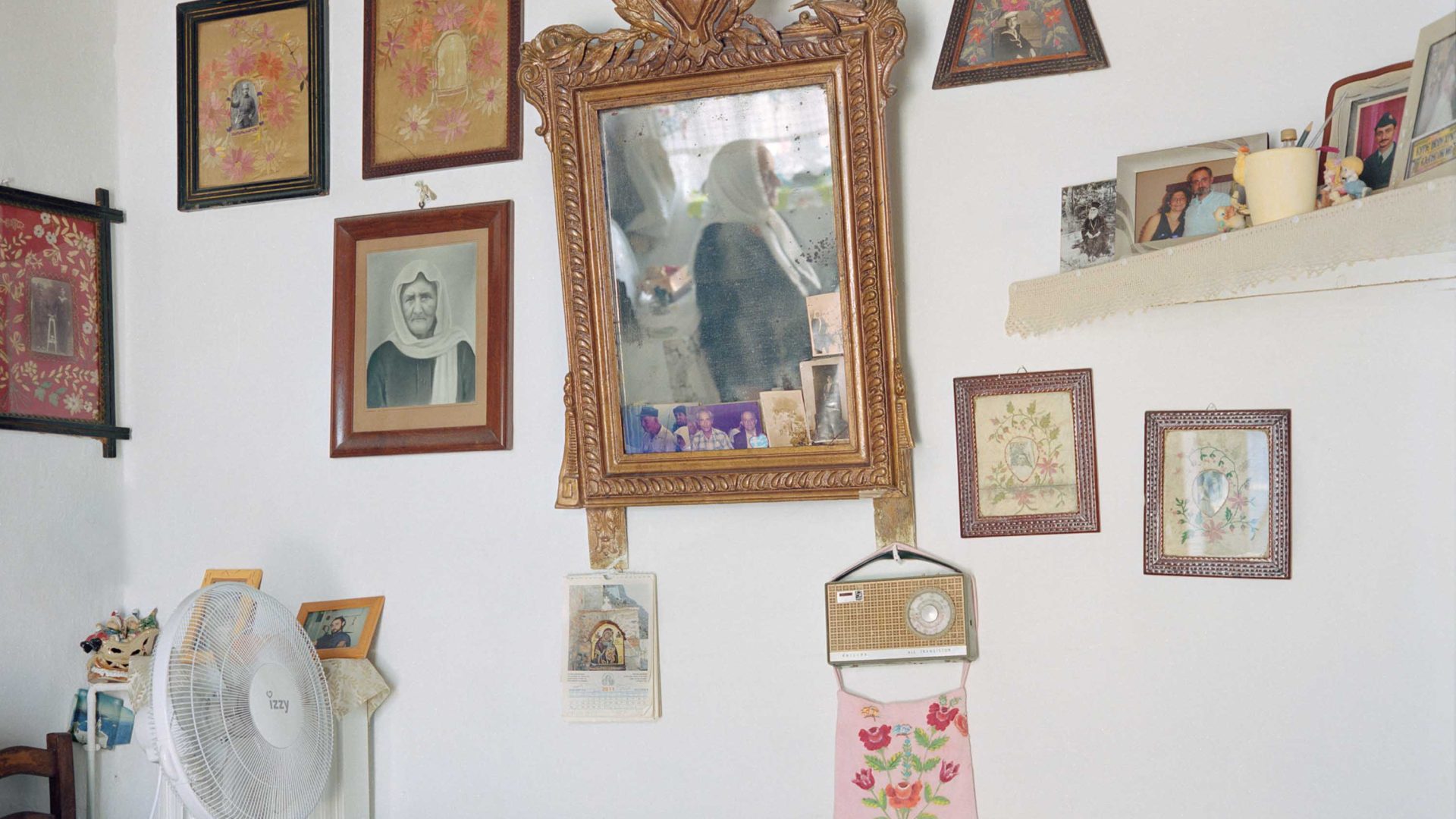 Photos in frames on a wall.