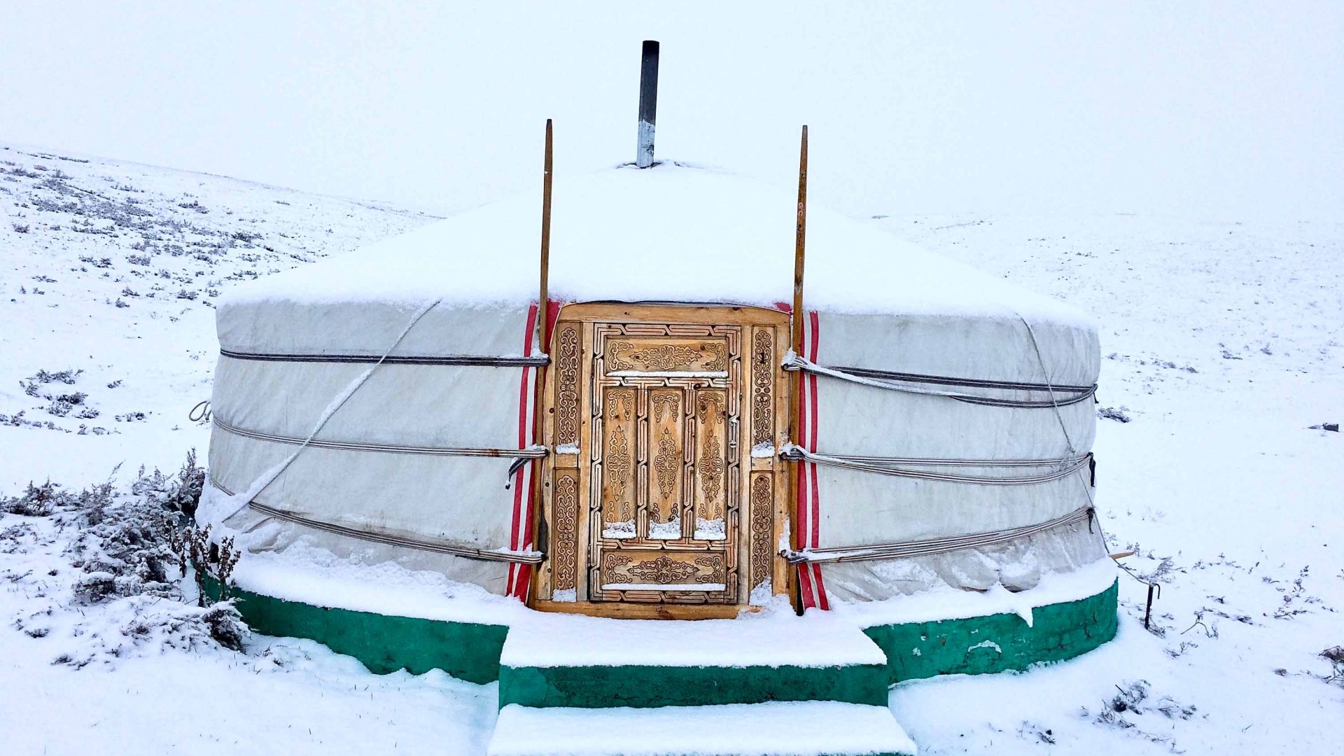A Mongolian yurt in the snow.