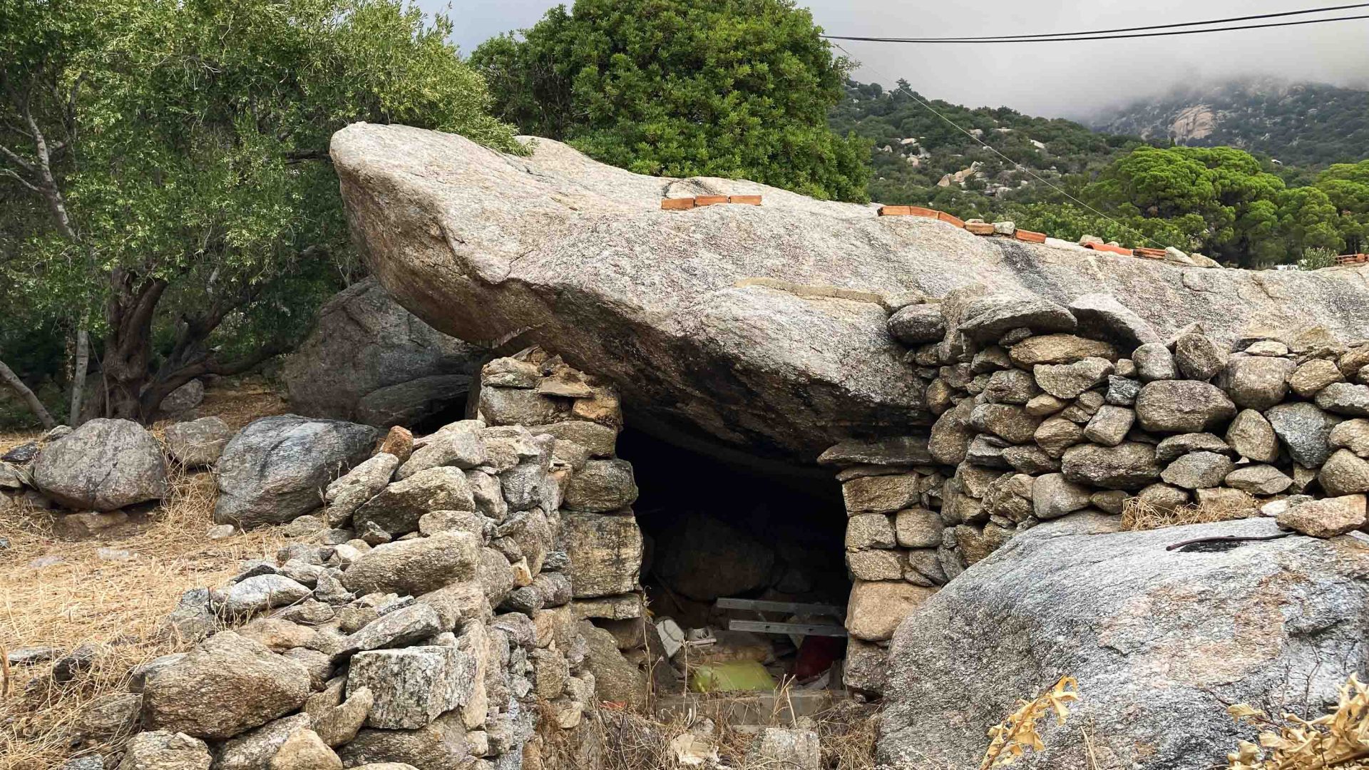 A stone house hidden into the mountain.