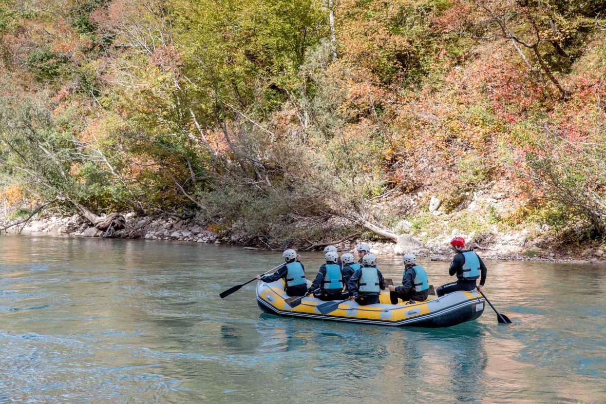 A group rafts on a river in Bosnia.