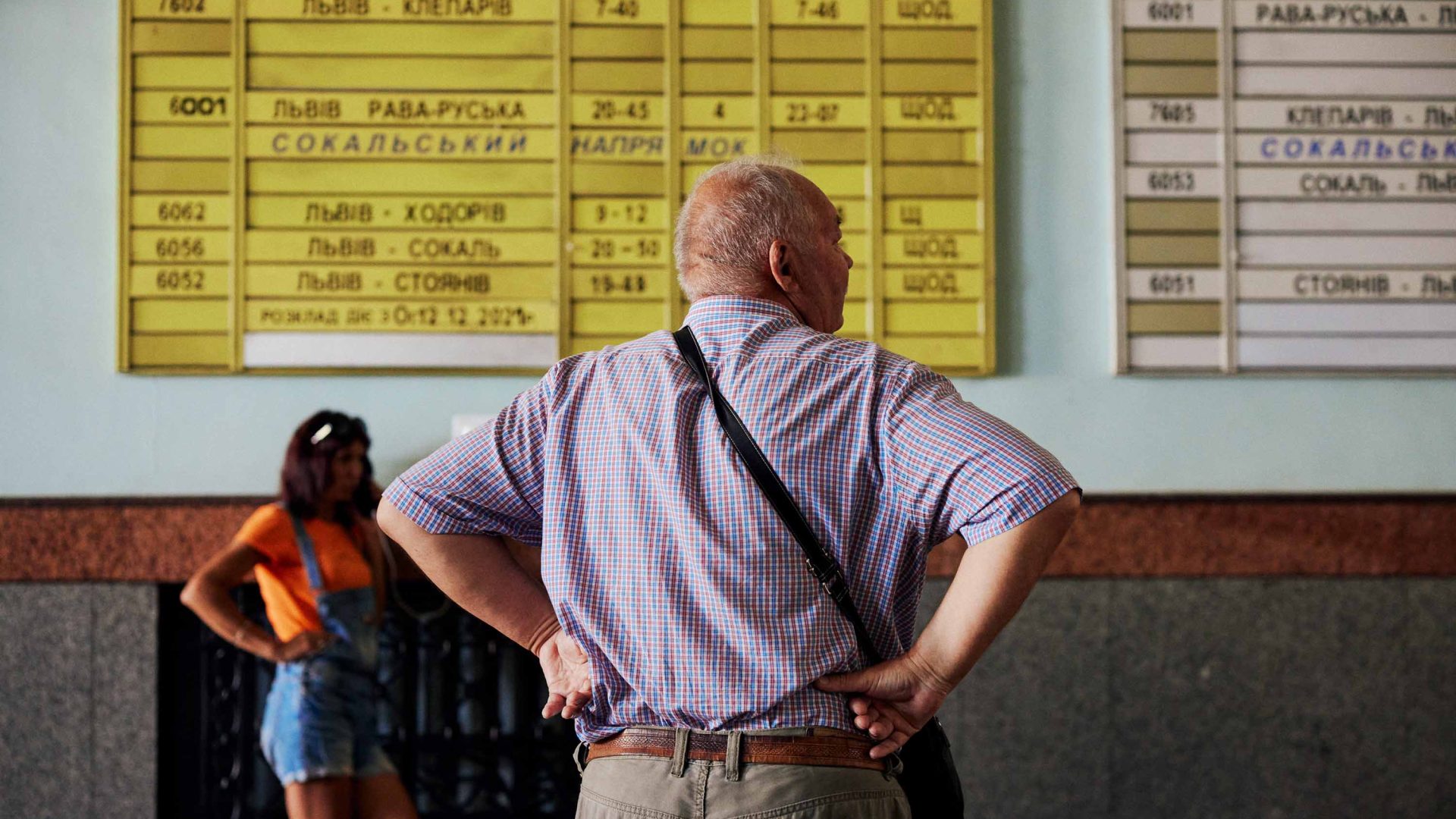 A man looks at a timetable