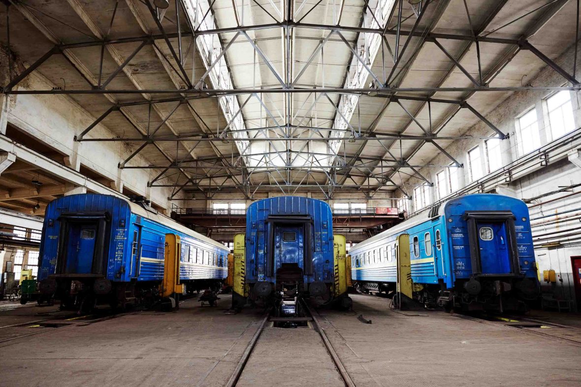 Three blue trains side by side.