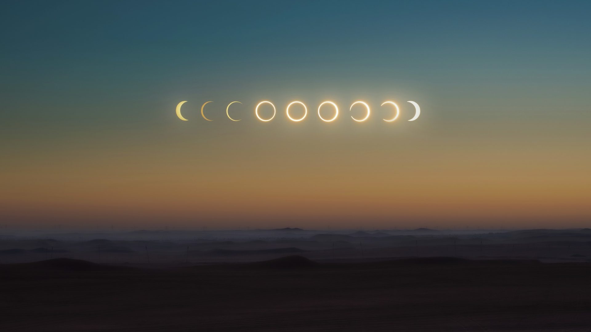The various stages of a solar eclipse are shown in a sky at dusk.