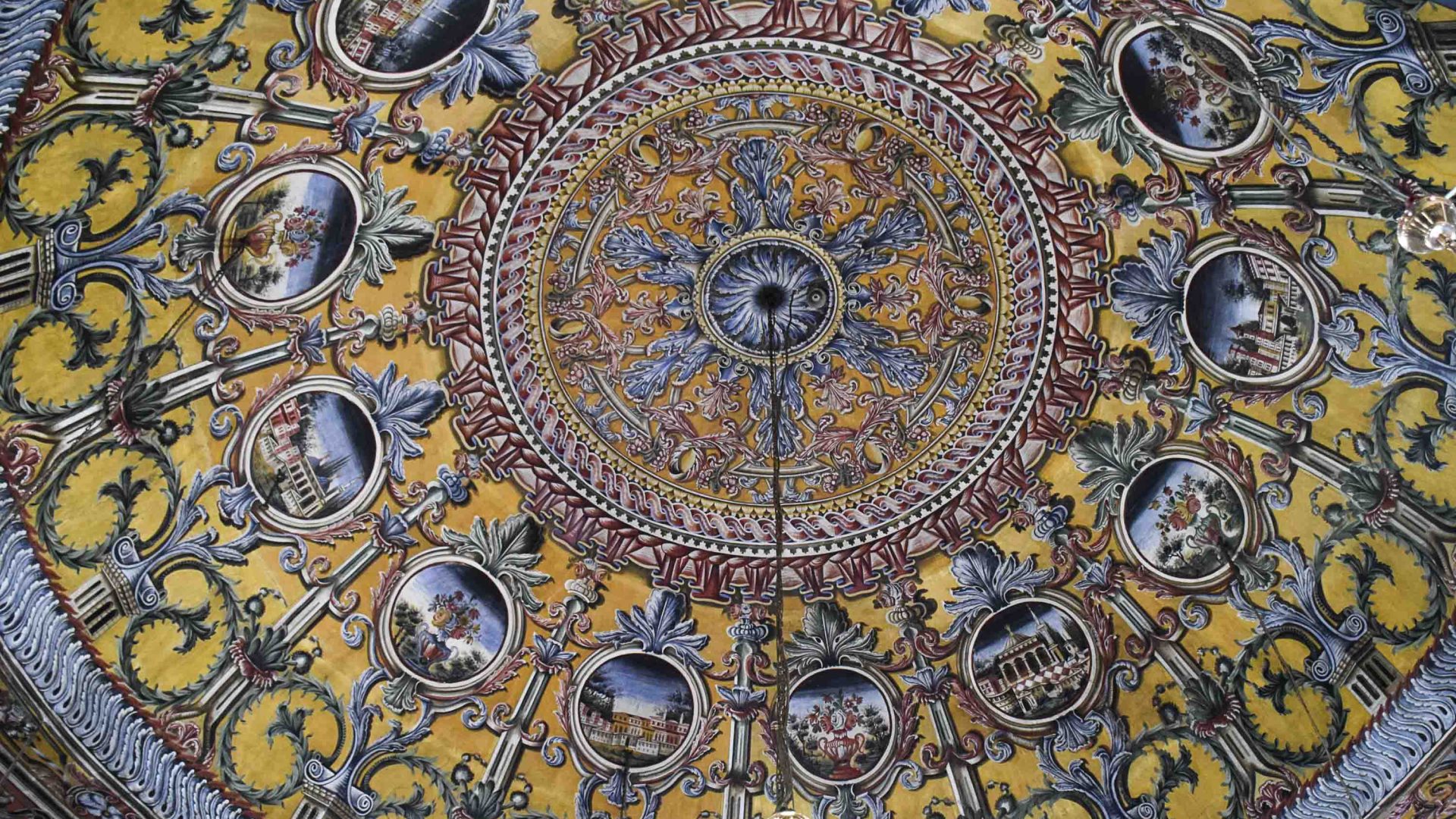 The European-Muslim art style inside the Ali Pasha Mosque. Circular in shape with a range of patterns and colors.