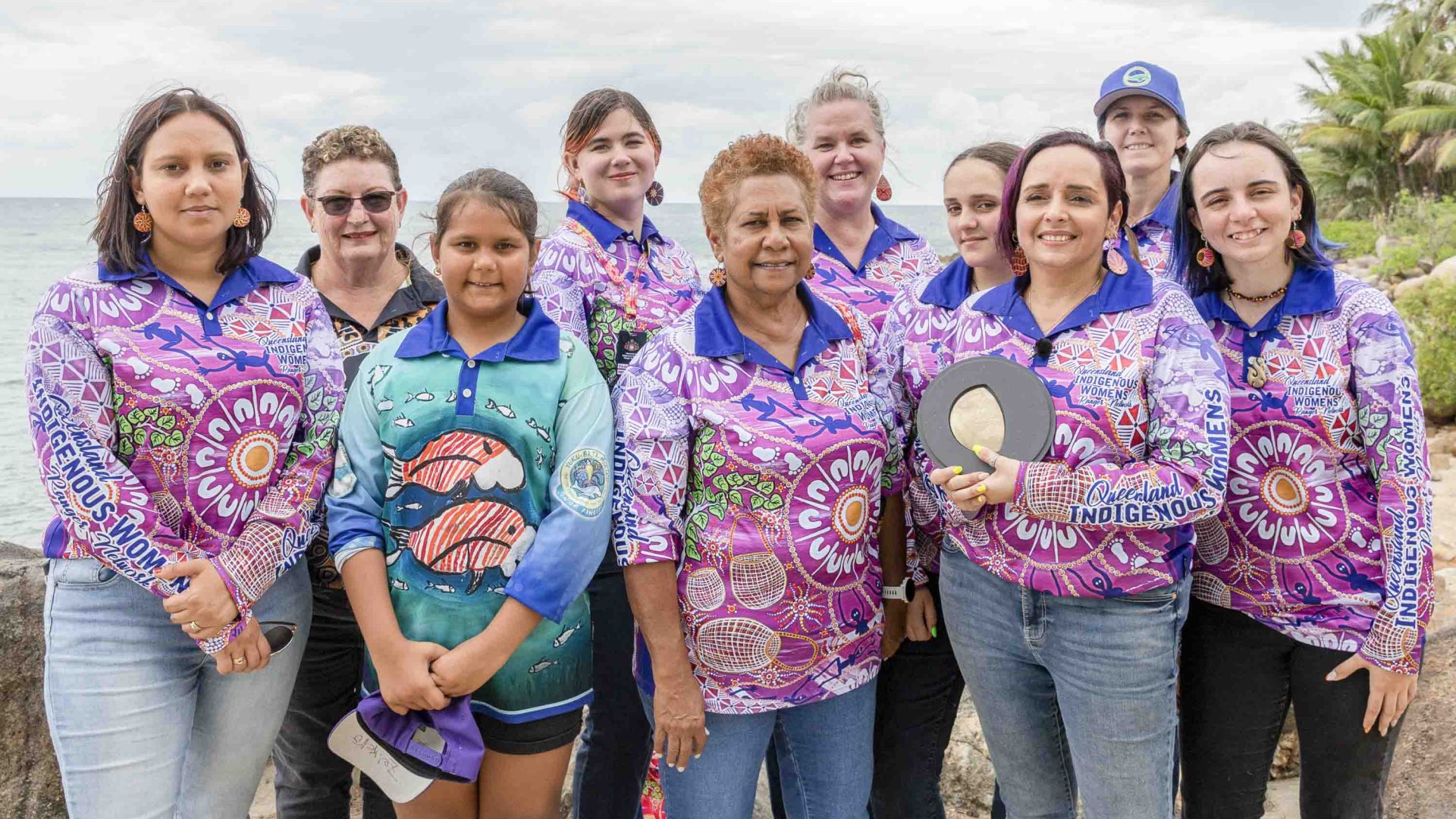 A group of Indigenous rangers pose for a photo with their prize.