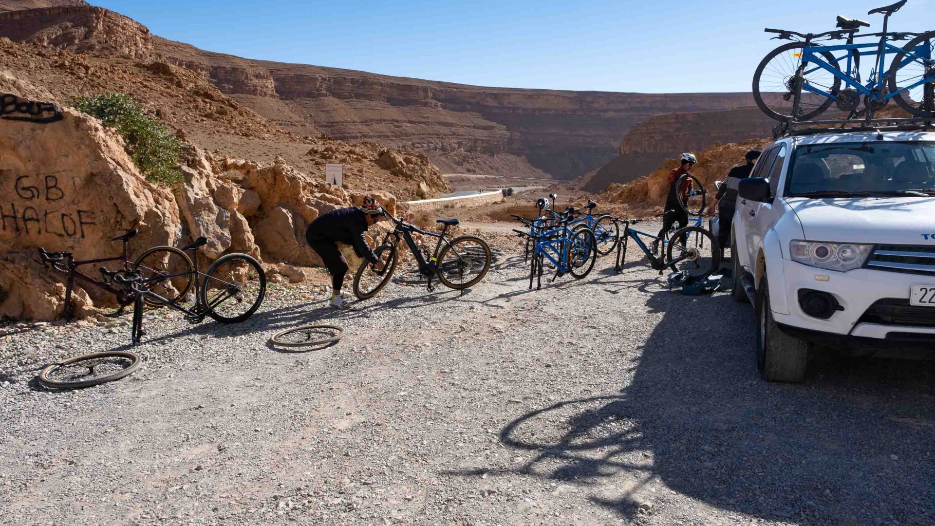 A group checks over their bikes.
