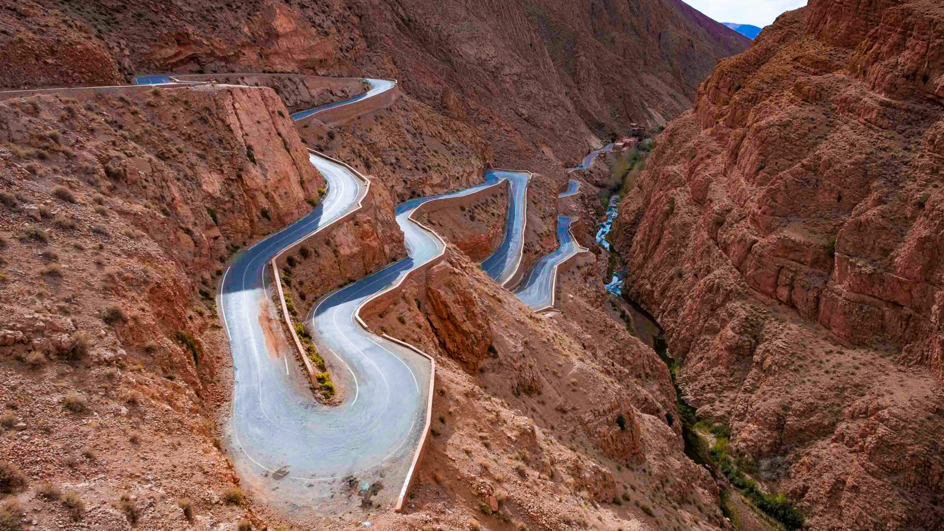 A windy road through bare mountains.