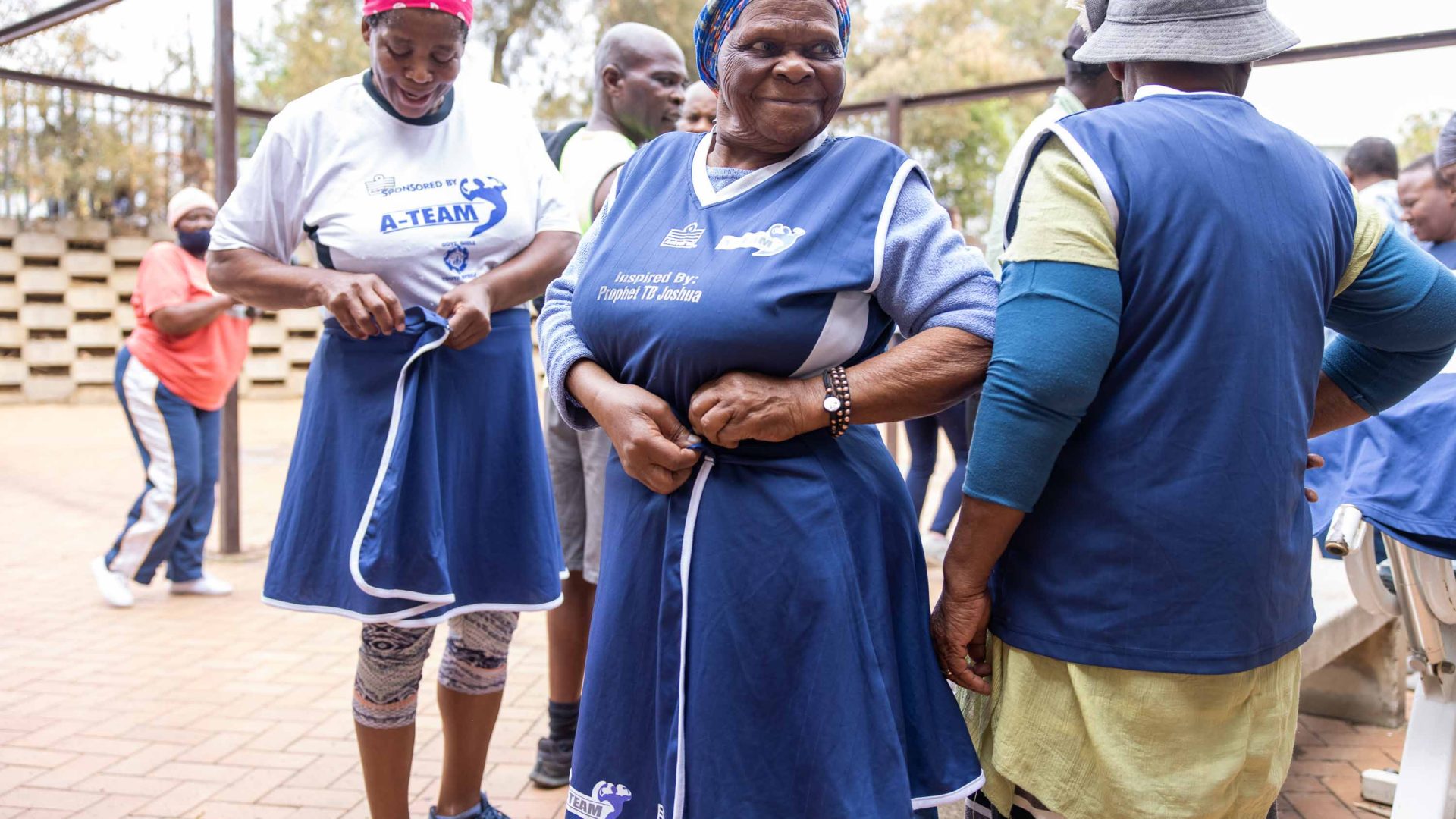 Boxing grannies change into their blue tunics.