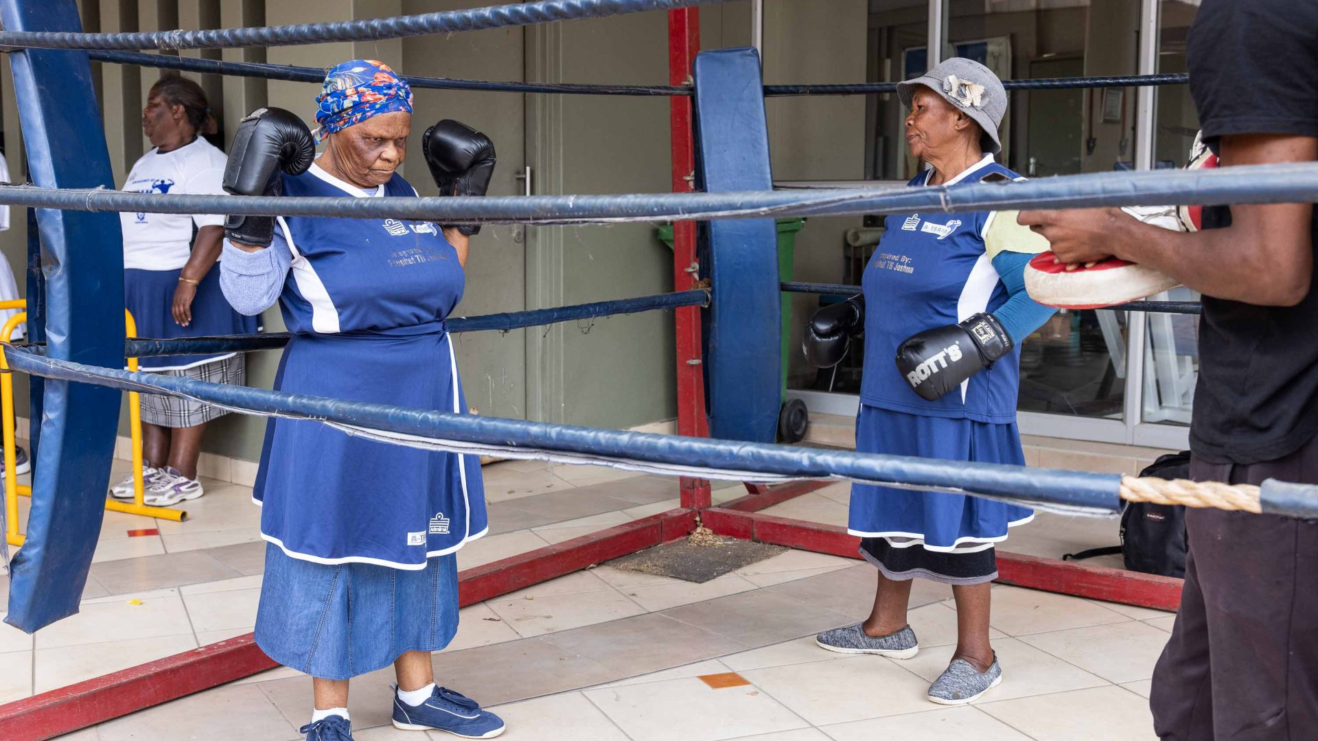 Two boxing grannies in a ring.