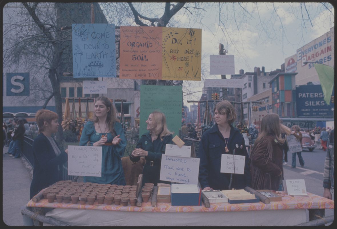 Organizers with posters stand at an outdoor booth in New York City's Union Square during the first ever Earth Day, on April 22, 1970.